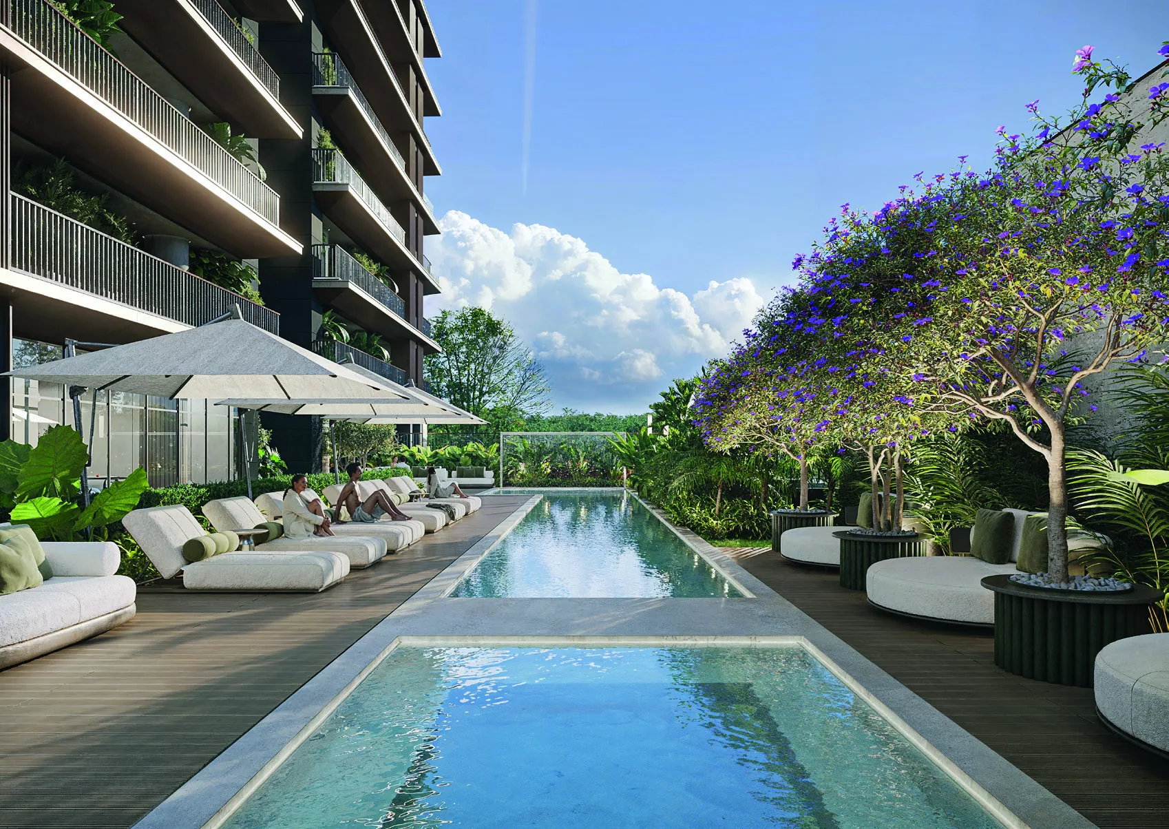 Piscina externa do NAEEM com lounge chairs e jardim florido