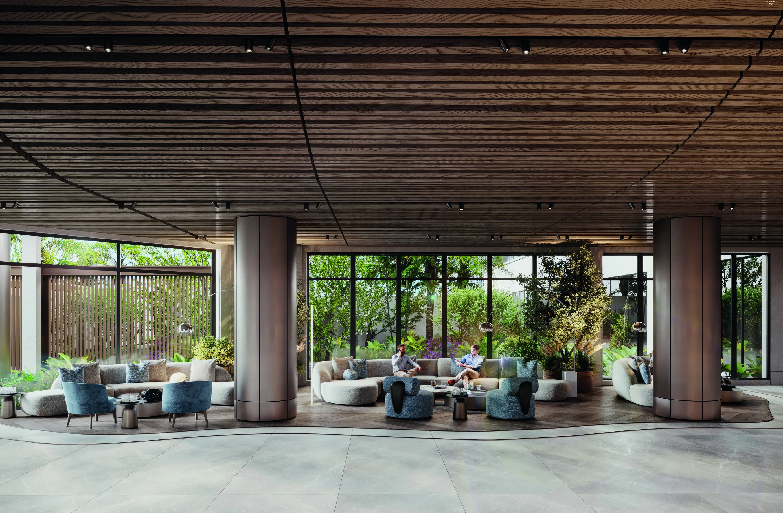 Lobby NKEY com colunas bronze e sofás em arco voltados para o jardim